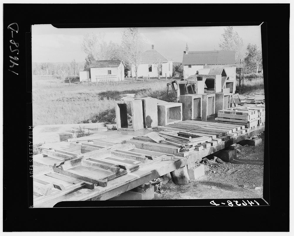 Concrete floor slabs, mud sills, and riser stools poured at central shop yard for farmers in Minnesota. Central construction…