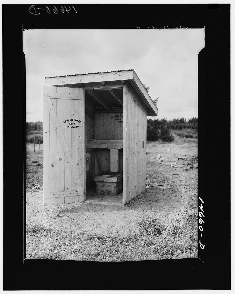 Complete privy properly protected to prevent flies from spreading diseases. Sourced from the Library of Congress.