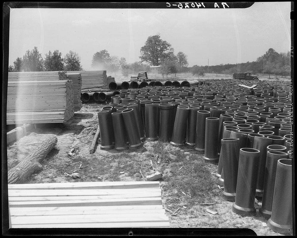 General building material. Tile pipes and lumber. Berwyn, Maryland. Sourced from the Library of Congress.