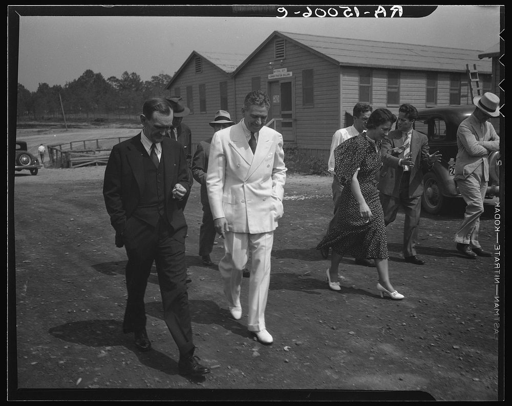 Resettlement Administrator R.G. Tugwell with his aides at the Greenbelt project, Maryland. Sourced from the Library of…