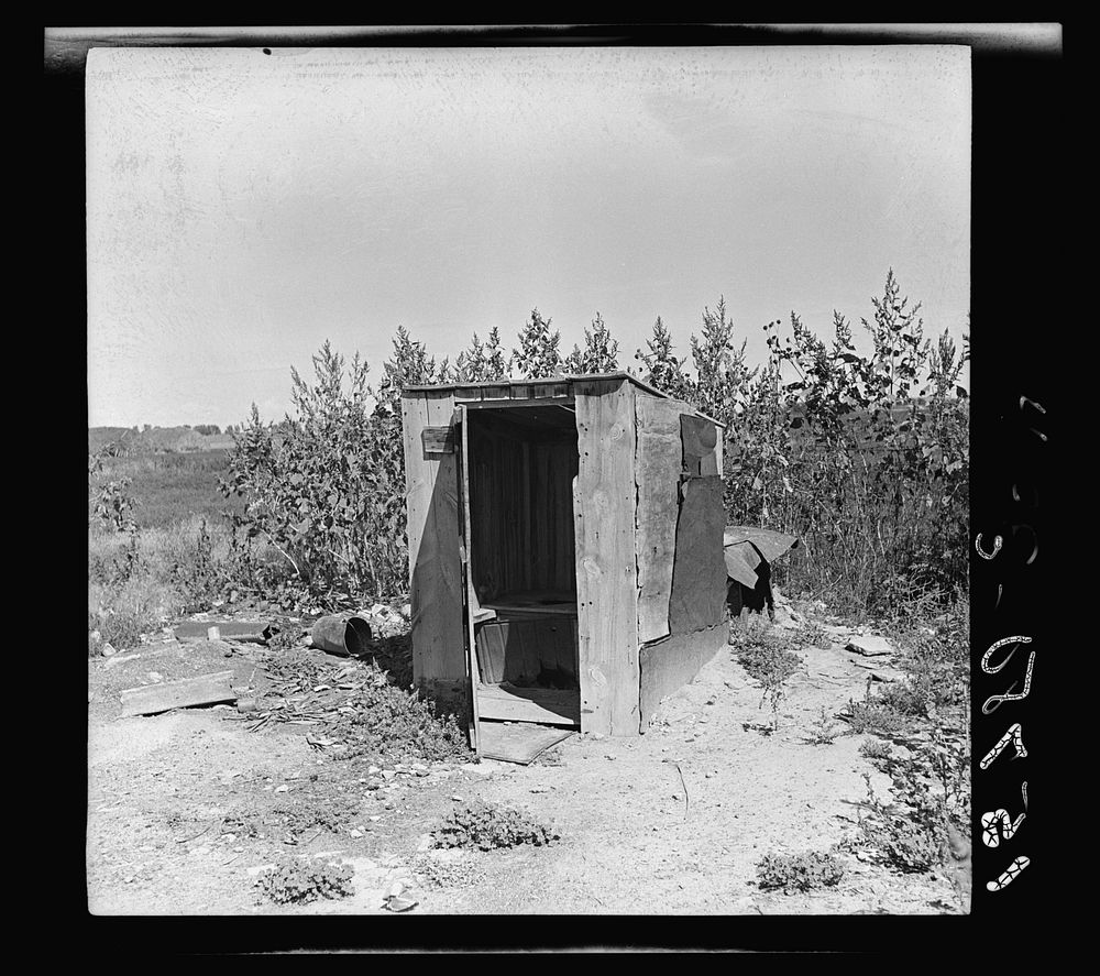 One of the four outhouses which serve fifty people. Great Western Sugar Company's beet sugar workers' colony at Hudson…