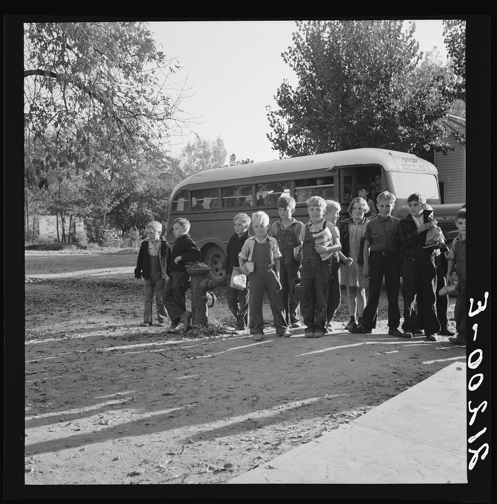 [Untitled photo, possibly related to: The children from Dead Ox Flat get off bus at school yard. Ontario, Malheur County…