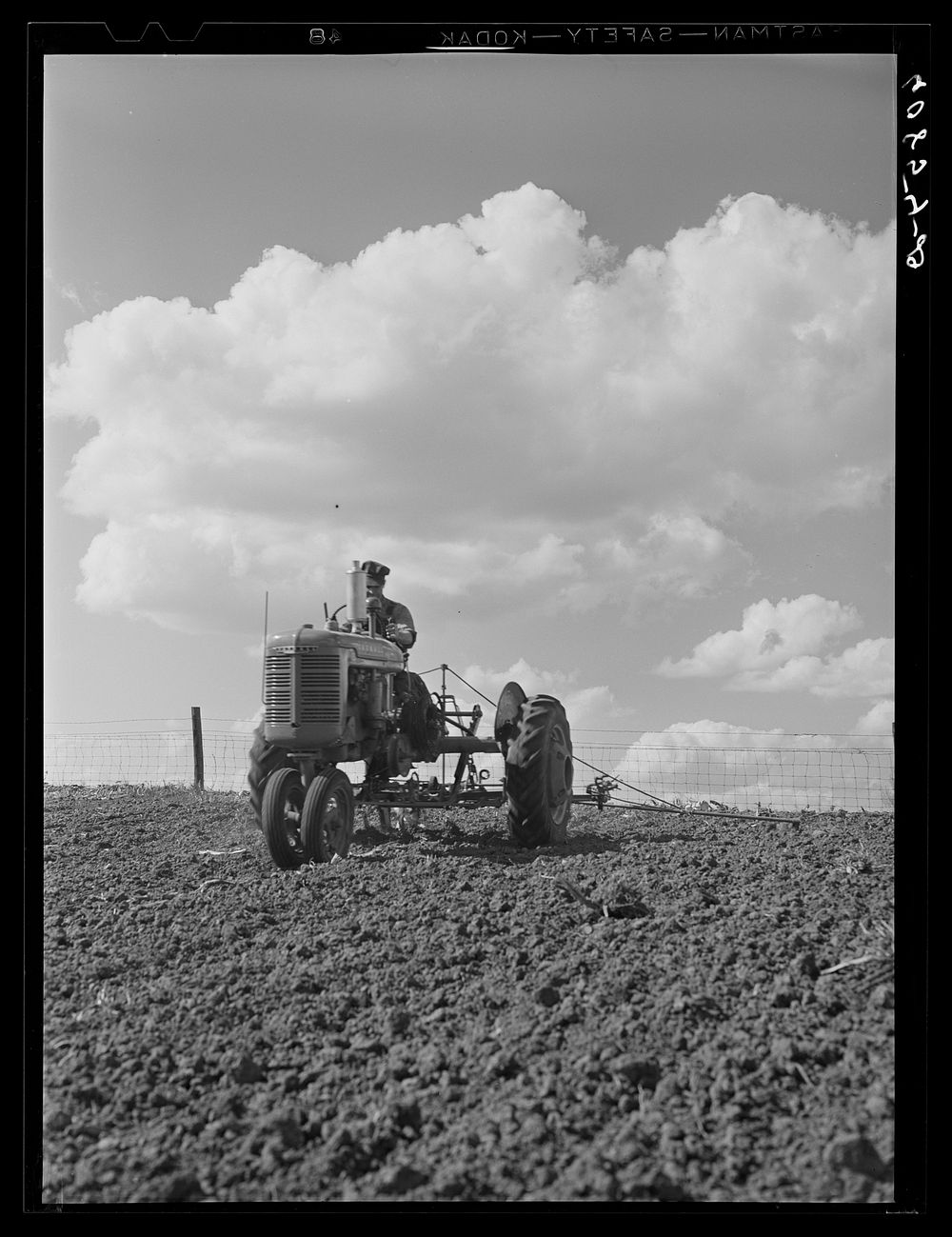 Corn planting with two-row tractor planter. Jasper County, Iowa. Sourced from the Library of Congress.