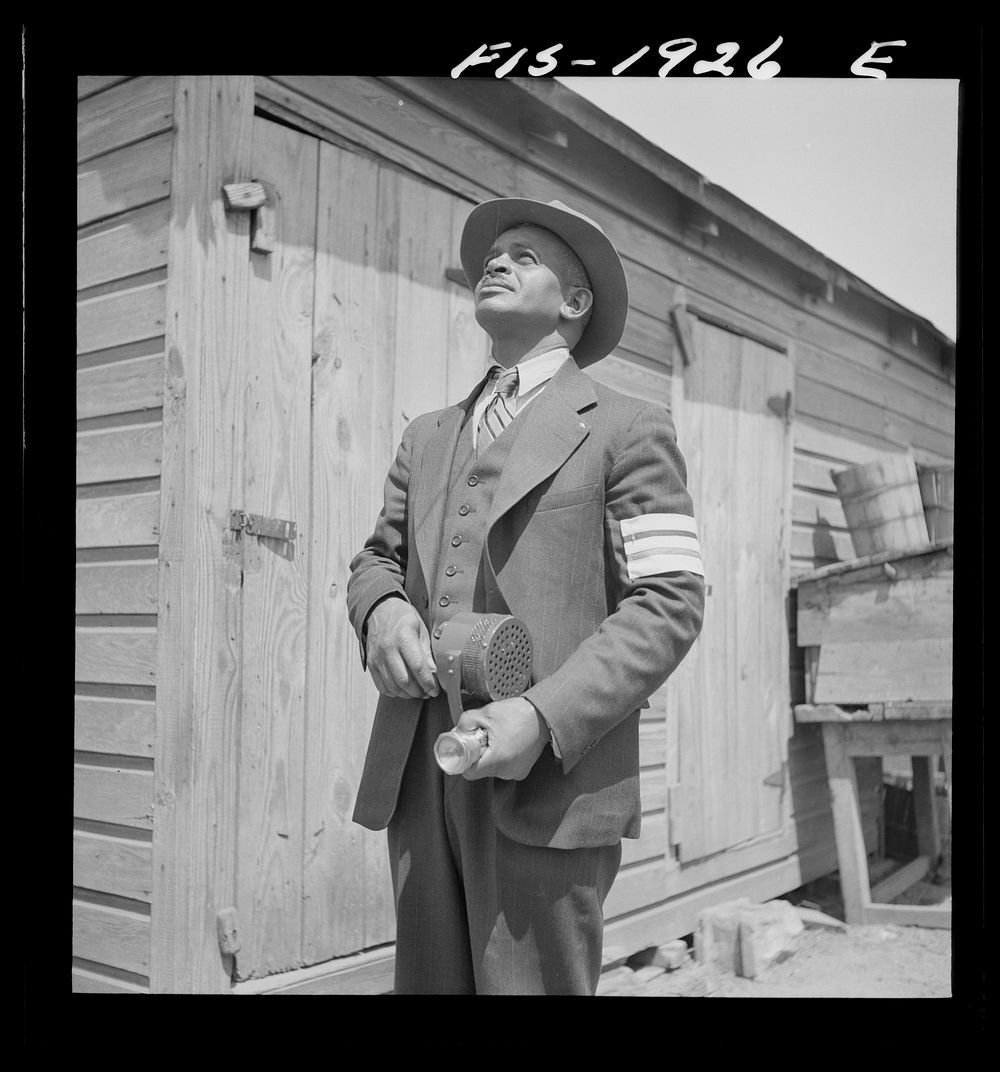 Newport News, Virginia.  shipyard worker does volunteer duty as an air raid warden. Sourced from the Library of Congress.