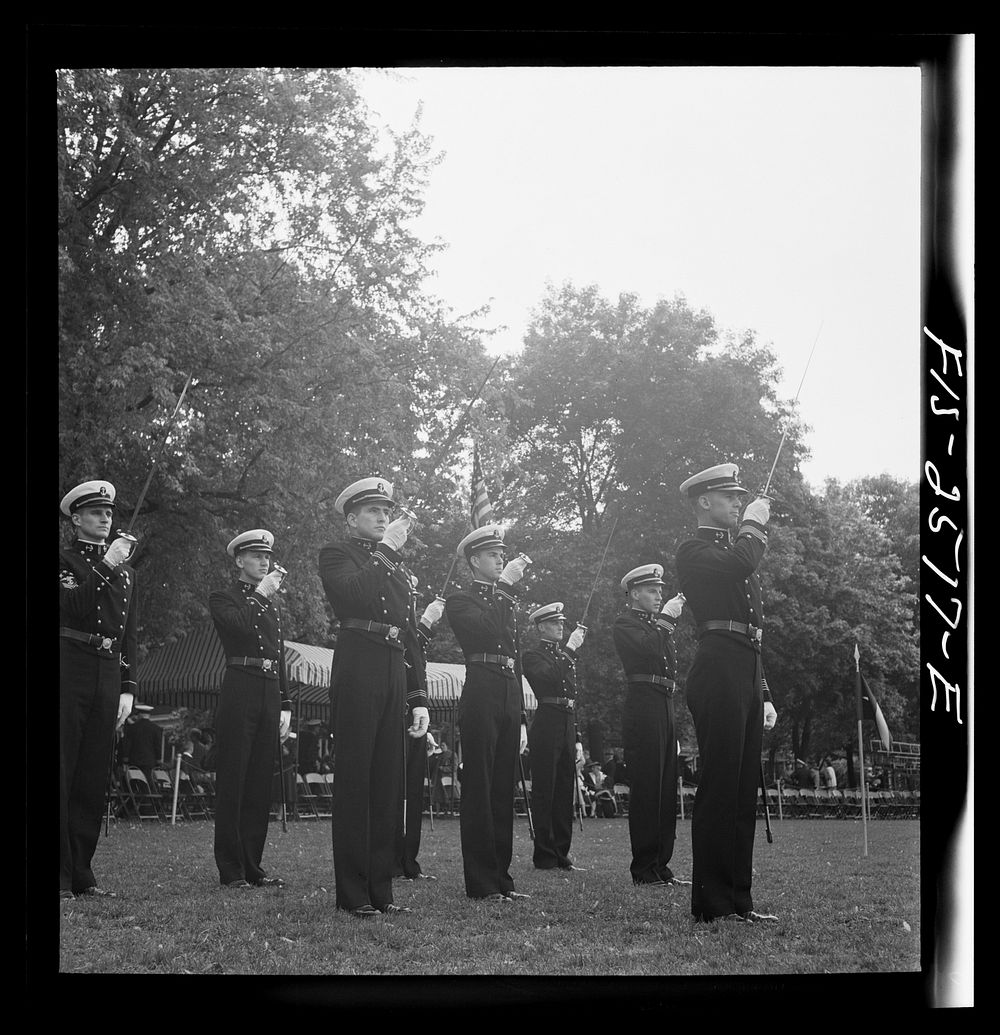 Annapolis, Maryland. Officers of the midshipmen's regiment, U.S. Naval Academy, giving their saber salute. Sourced from the…