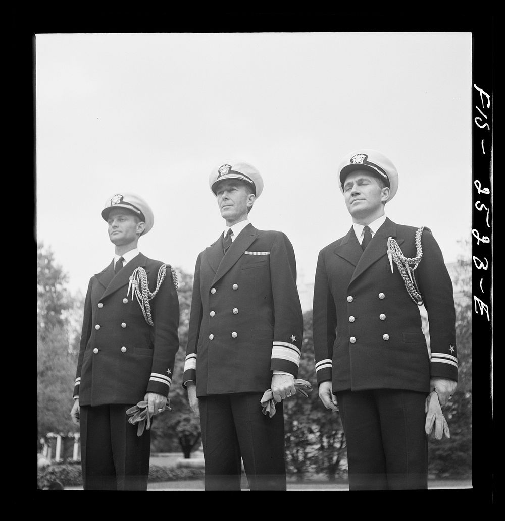 Annapolis, Maryland. Rear Admiral Beardall and his aides: Lieutenant Jones (left), and Lieutenant D.K. Martineau (right).…