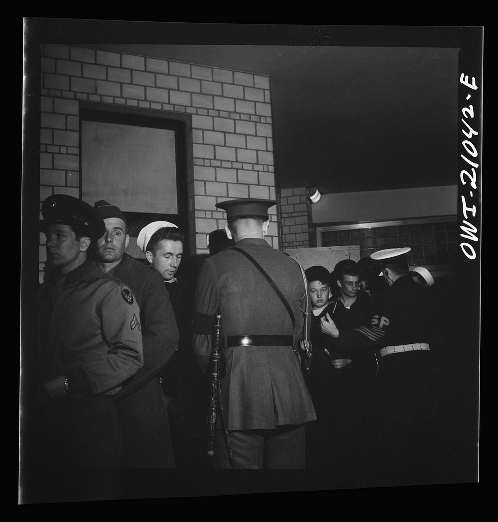 [Untitled photo, possibly related to: Washington, D.C. Boarding a special bus for servicemen. Leaving the Greyhound terminal…