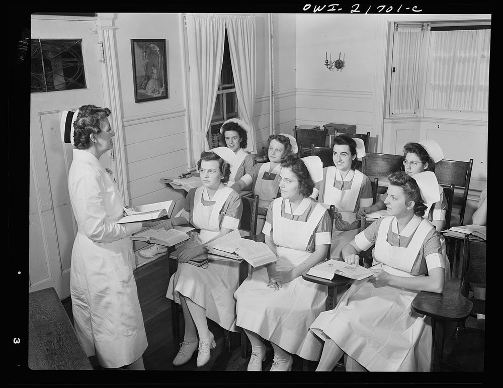 Rochester, New York. Shirley Babcock at right in the front listening to a lecture with other student nurses. Sourced from…