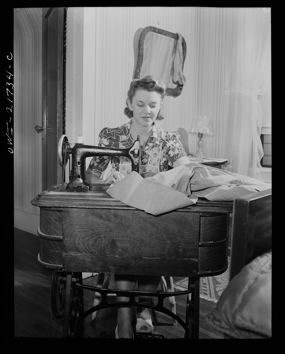 Rochester, New York. Shirley Babcock is very handy at the sewing machine and she helps her mother with the family sewing.…