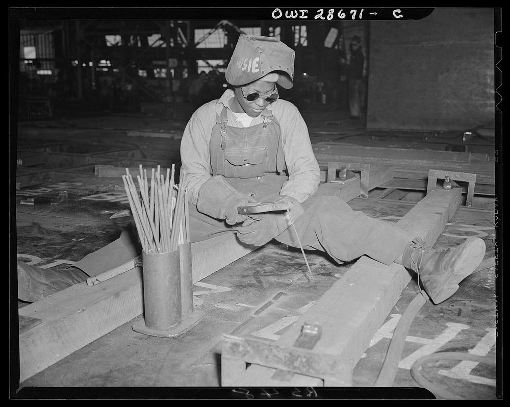 Kaiser shipyards, Richmond, Calif. 1943. Welder-trainee Josie Lucille Owens helping to construct the Liberty ship SS George…