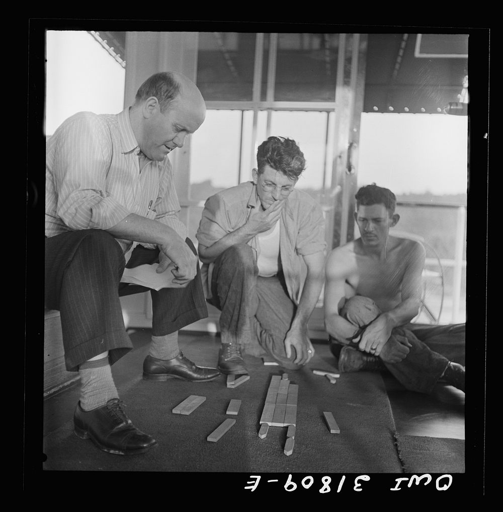 Using wooden blocks to make up the tow aboard the towboat Ernest T. Weir going down the Ohio River to Cincinnati. Sourced…