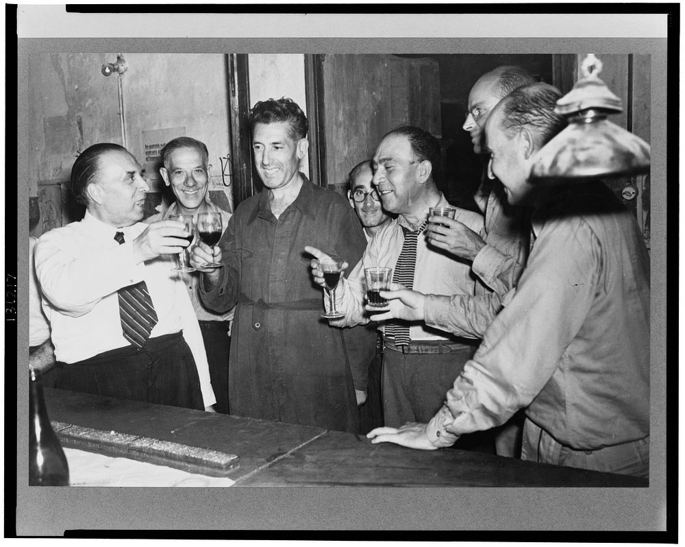 Sicilians drinking wine at a bar. Sourced from the Library of Congress.