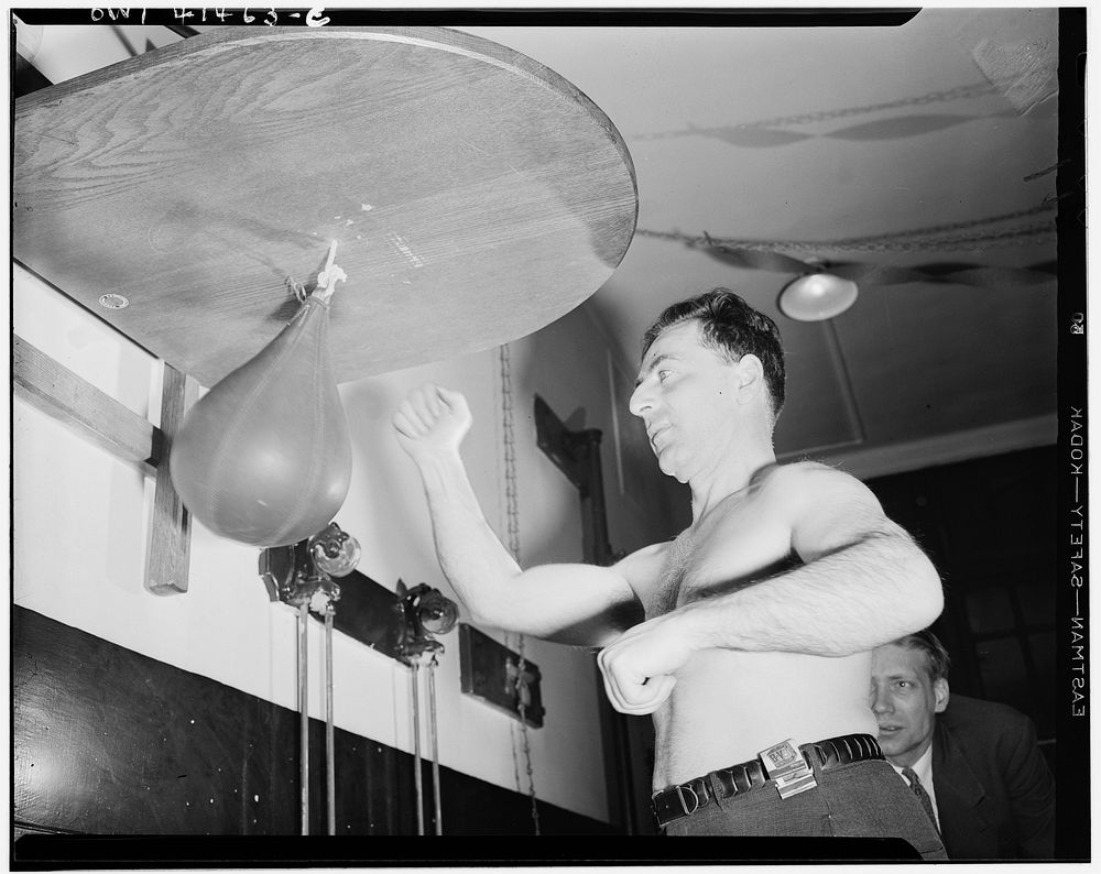 New York, New York. Joe Bruno, who is blind, giving a punching-bag a workout at the Lighthouse, an institution for the…