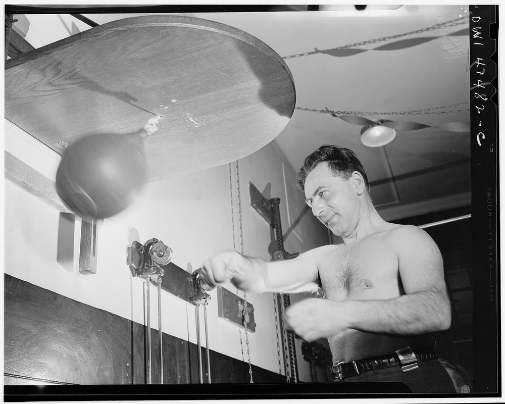 New York, New York. Joe Bruno (blind) punching the bag in the gymnasium at the Lighthouse, an institution for the blind, at…