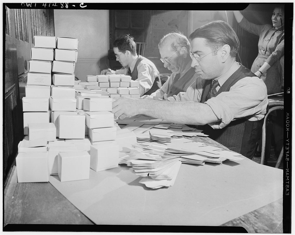 New York, New York. Blind men working on boxes for Elizabeth Arden cosmetics at the Lighthouse, an institution for the…