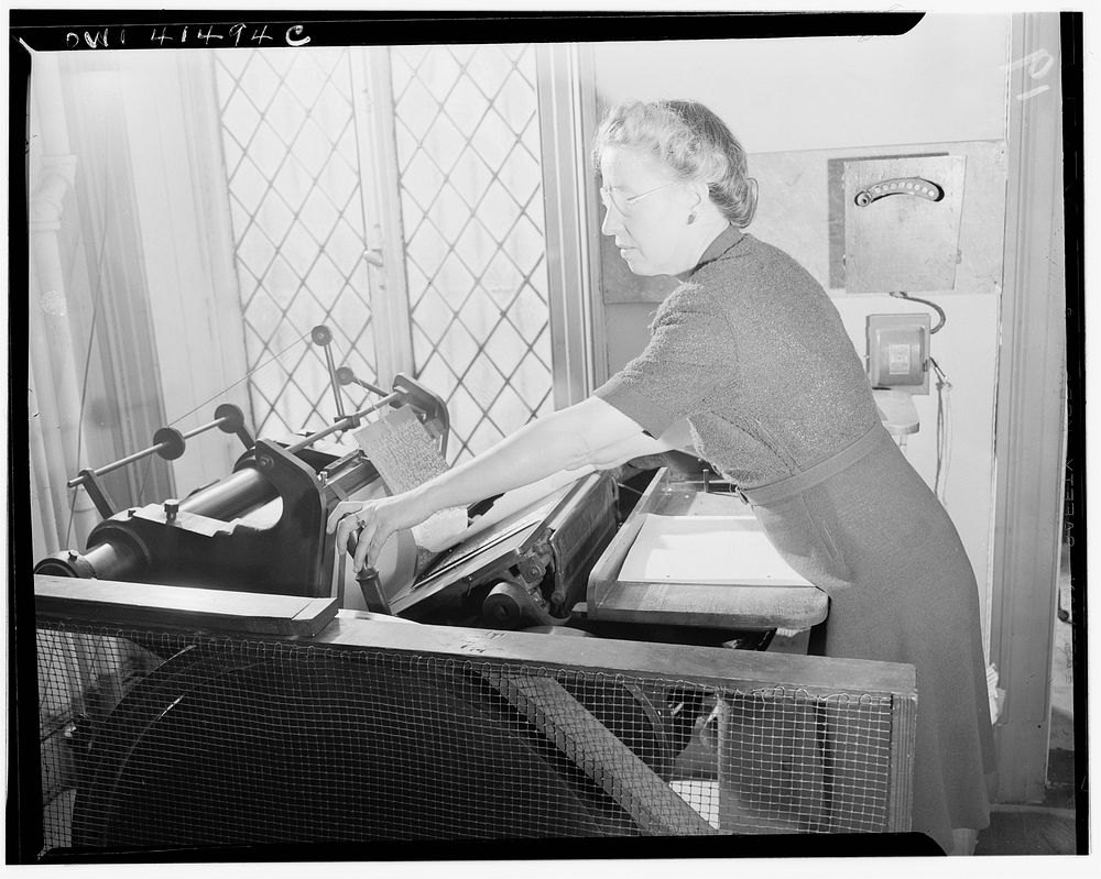 New York, New York. Charlotte Rohr operating the Braille press at the Lighthouse, an institution for the blind, at 111 East…