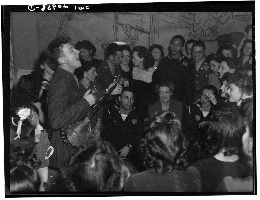 Washington, D.C. Pete Seeger, noted folk singer entertaining at the opening of the Washington labor canteen, sponsored by…
