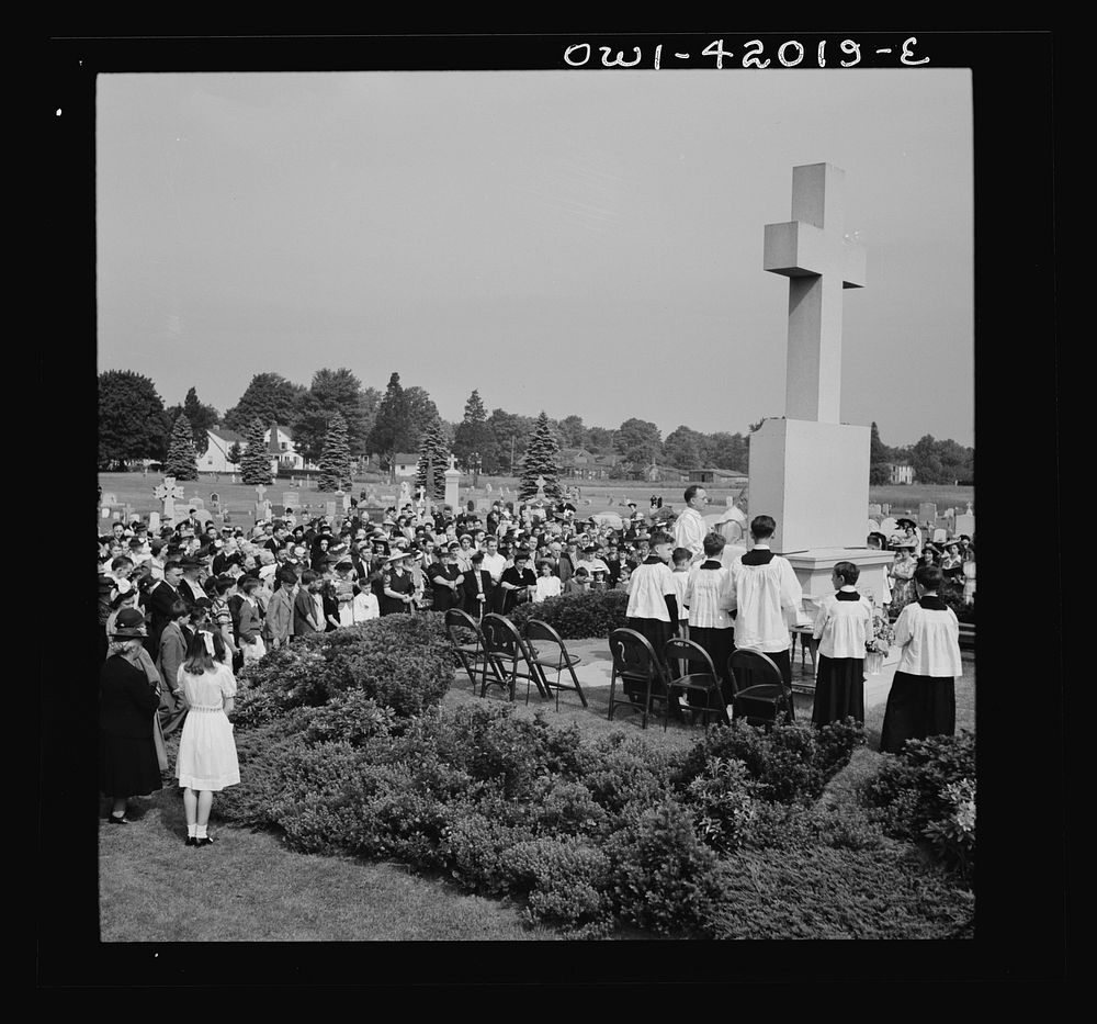 Southington, Connecticut. On All Souls' Day, the Catholic congregation is gathering in the Saint Thomas Cemetery for an…
