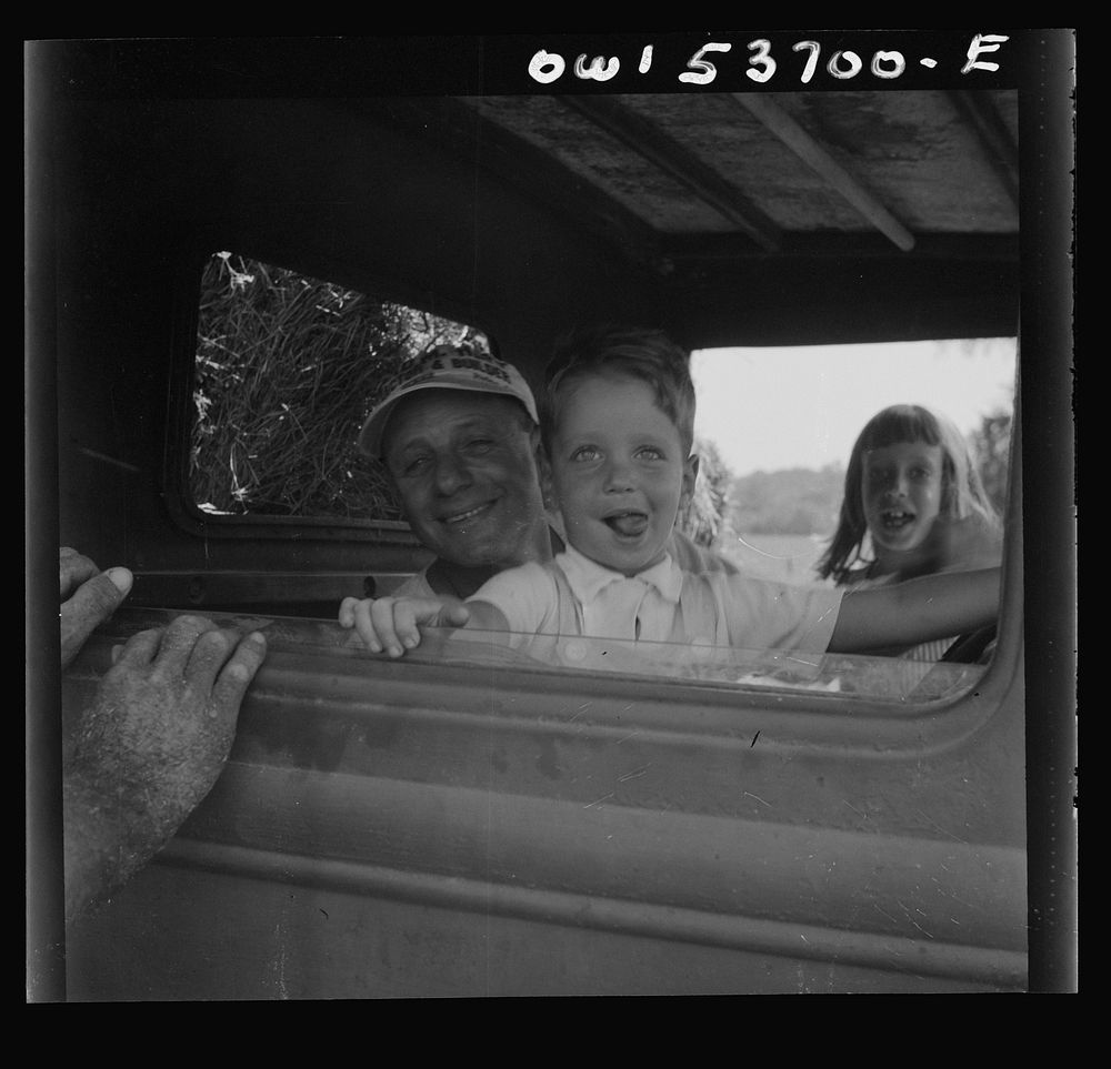 [Untitled photo, possibly related to: Dresher, Pennsylvania. The owner of the Spring Run Farm driving a tractor]. Sourced…