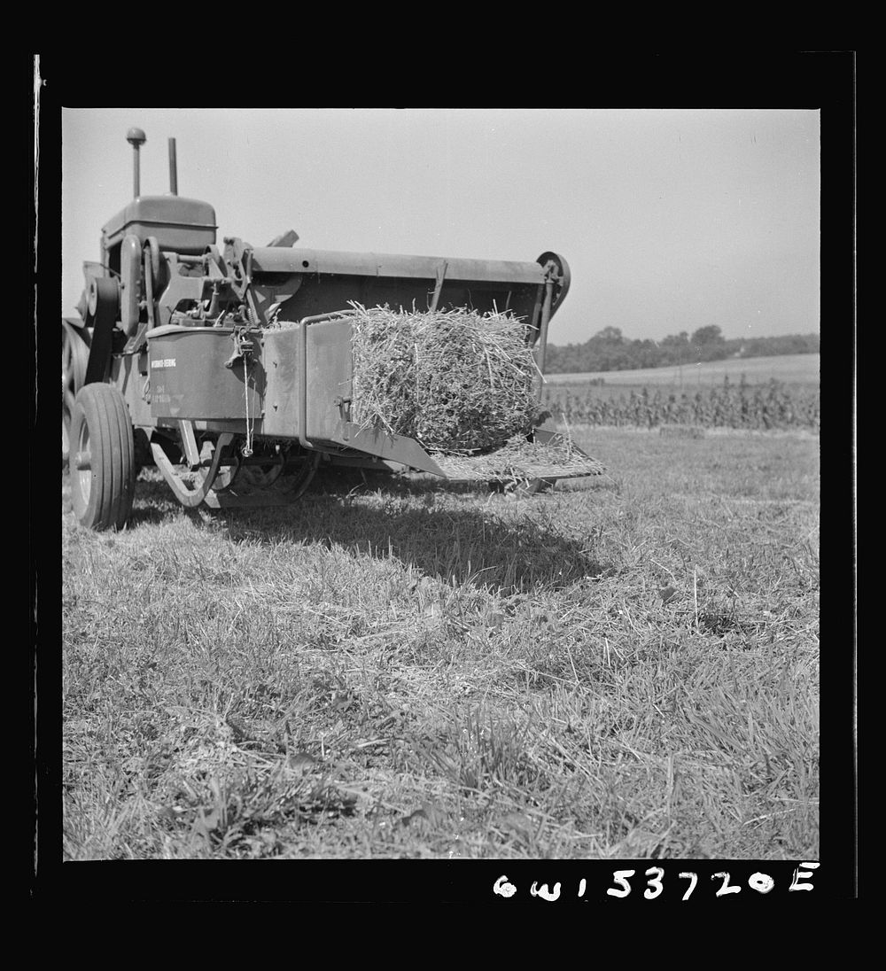 Dresher, Pennsylvania. Baling machine operating at the Spring Run Farm. Sourced from the Library of Congress.