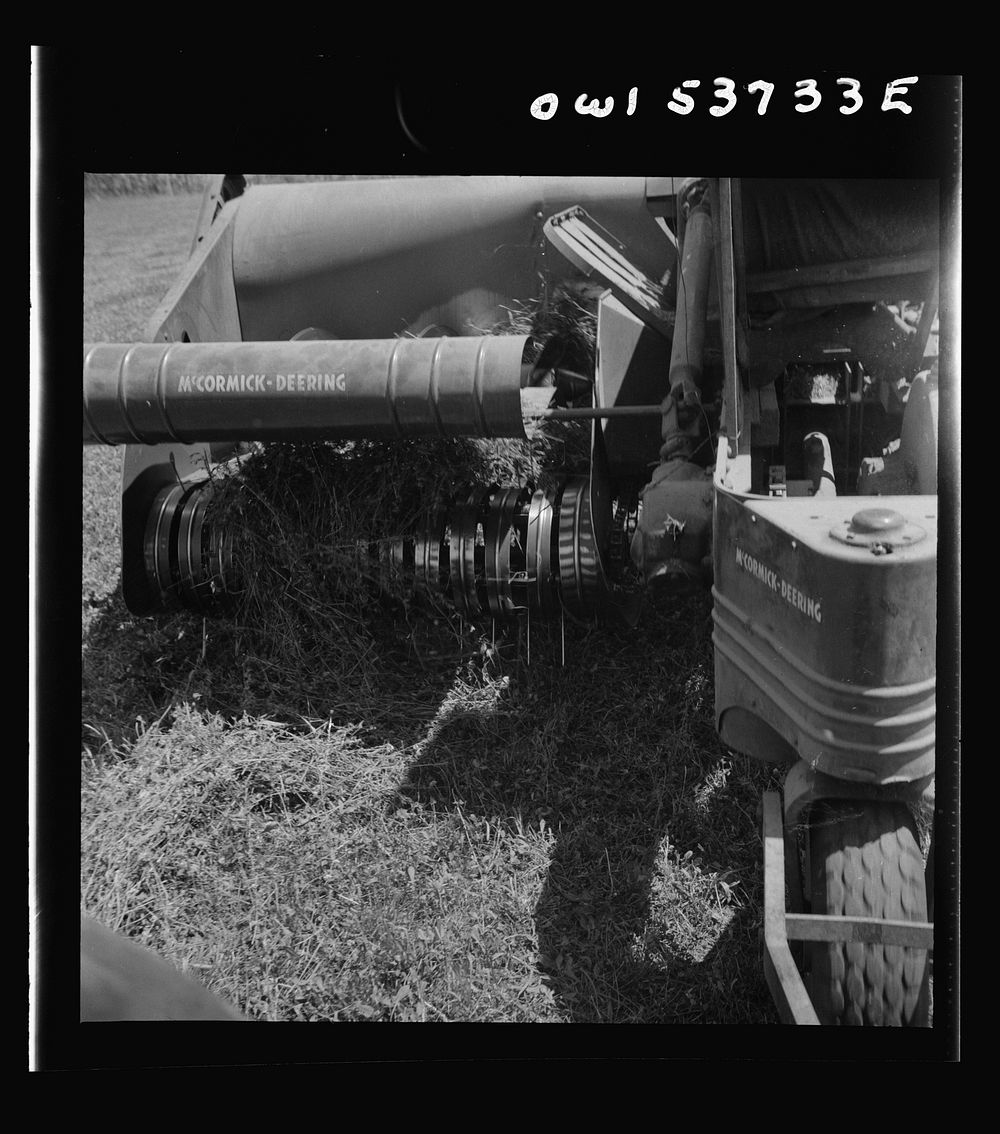 Dresher, Pennsylvania. Detail of baling machine showing hay being picked up at the Spring Run Farm. Sourced from the Library…