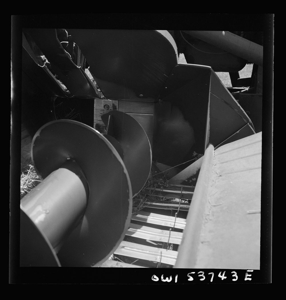 Dresher, Pennsylvania. Detail of a hay baler showing rotating knives which cut hay into proper lengths. Sourced from the…