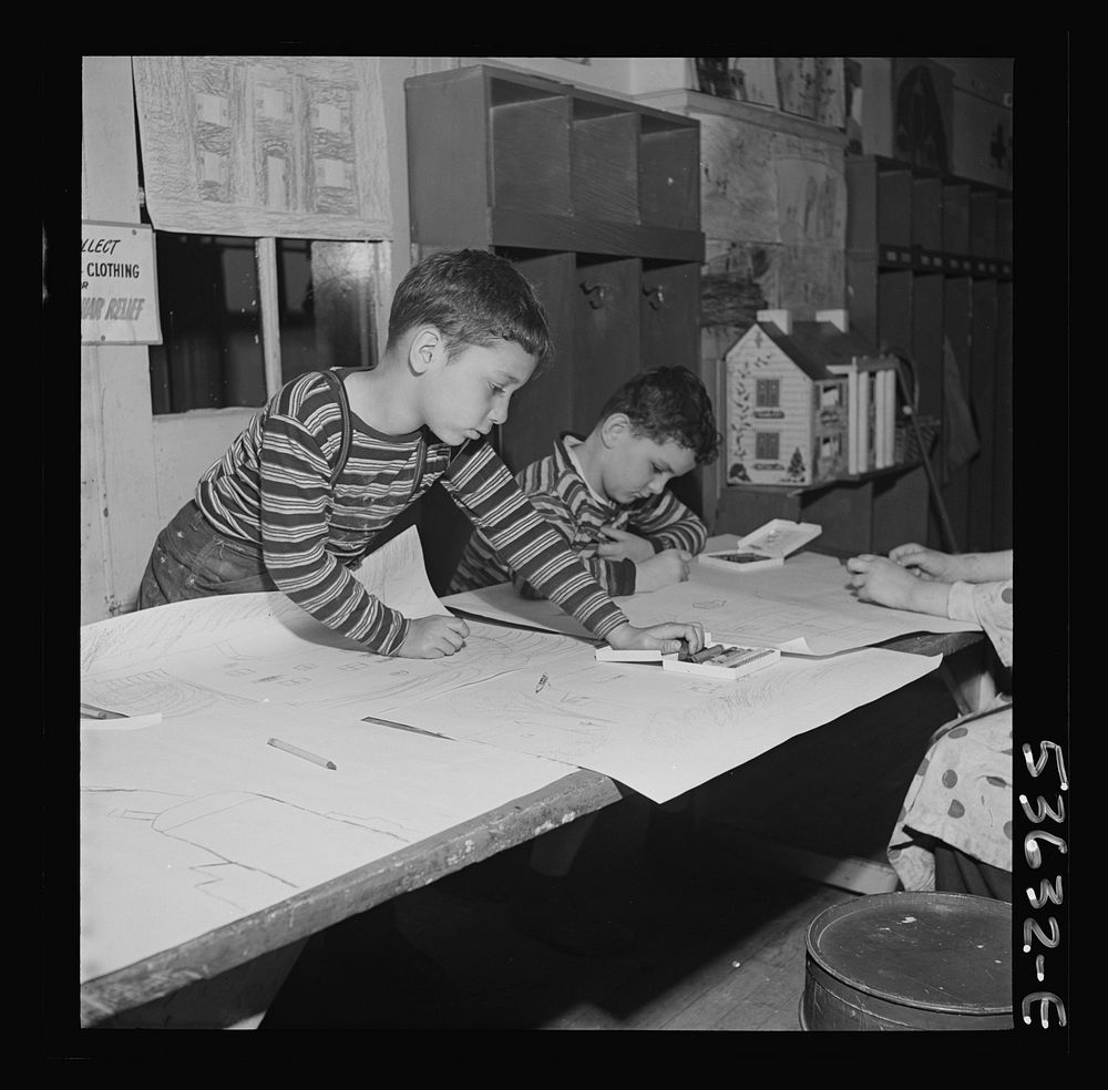 New York, New York. Two young boys, sons of working mothers, making drawings at Greenwich House, a community center where…