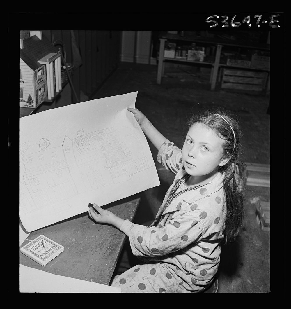New York, New York. A working mother's child who receives day care after school and on Saturdays at Greenwich House, proudly…