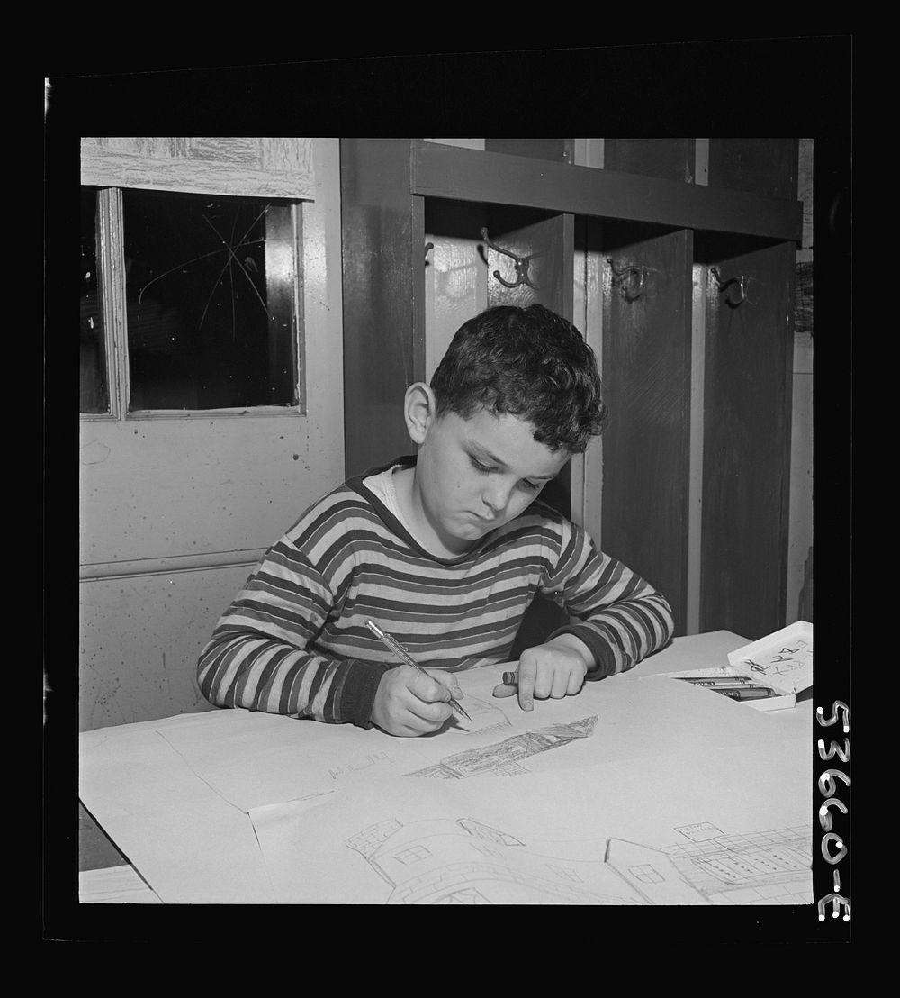 New York, New York. A young draftsman drawing plans for a house and developing his favorite hobby at Greenwich house where…