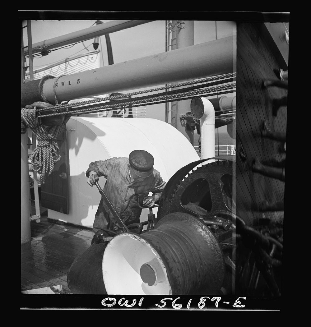 On board S.S. Athenia. Machinist working on a winch. Sourced from the Library of Congress.