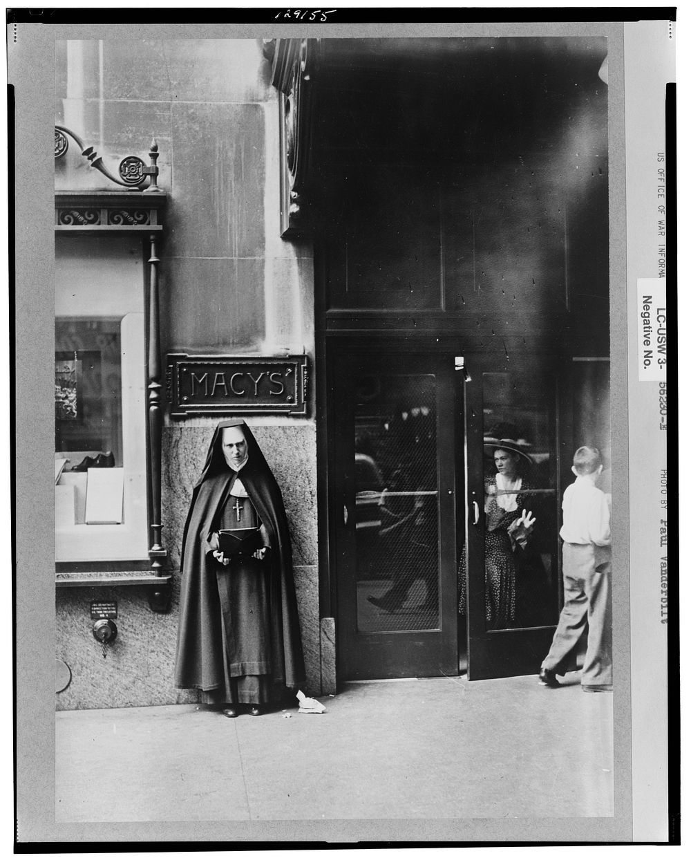 New York, New York. A nun collecting contributions outside the door of Macy's department store. Sourced from the Library of…
