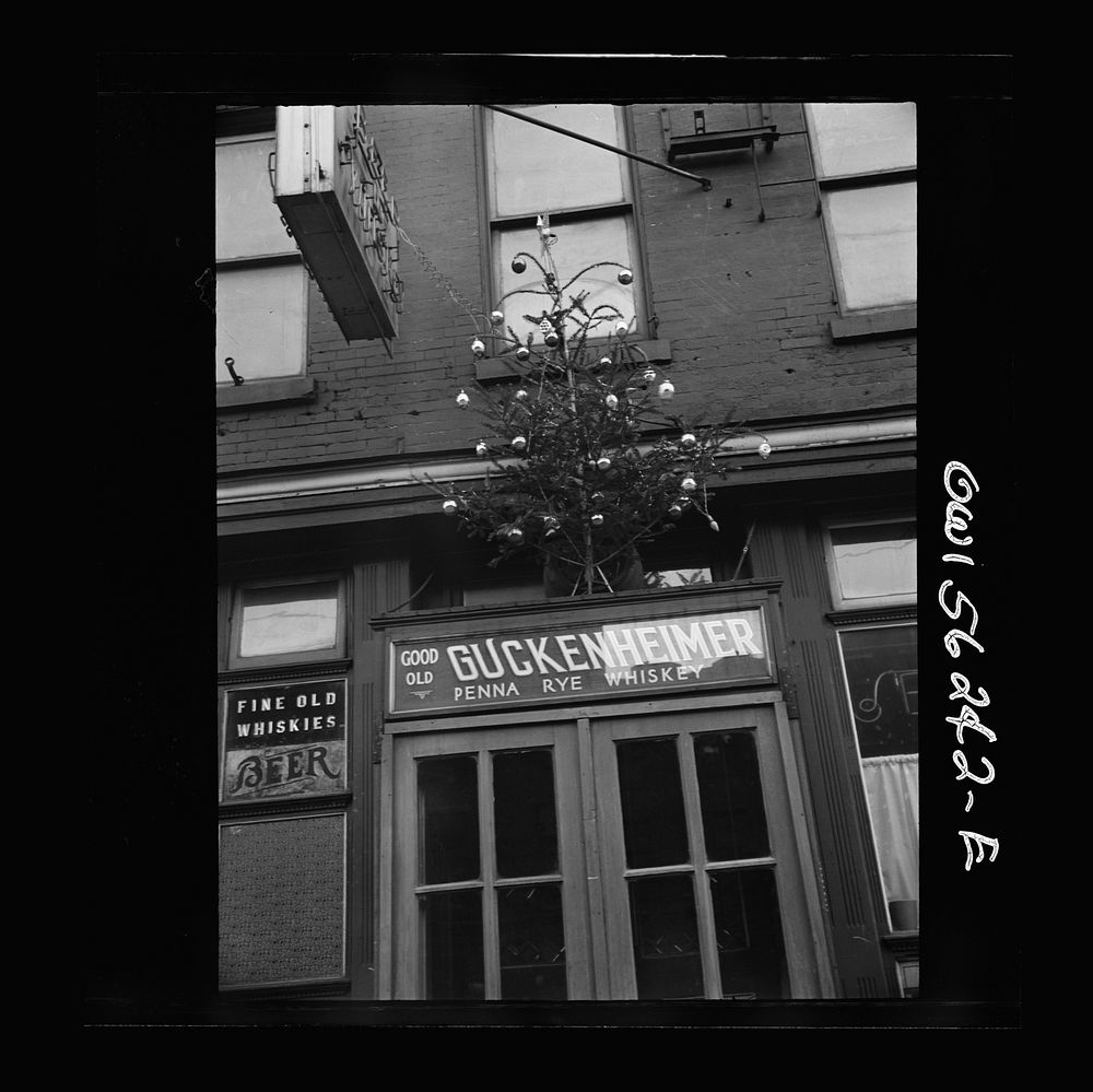 Philadelphia, Pennsylvania. Christmas tree over the door of a bar on Market Street. Sourced from the Library of Congress.