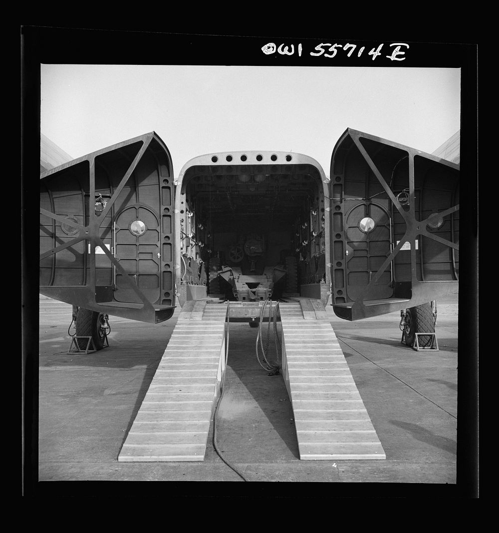 Rear view of C-82 shown at demonstration of equipment held by United States Army Air Forces. The after end of the fuselage…