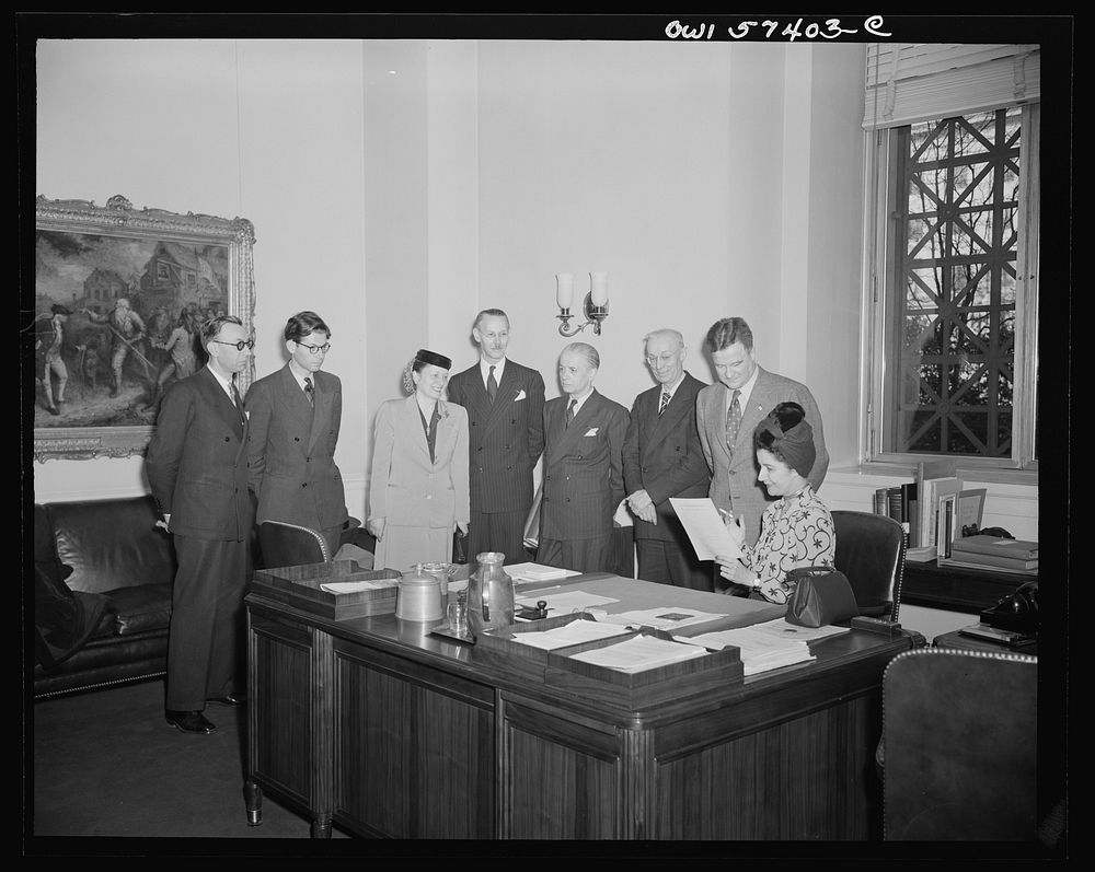 French journalists visit the National Gallery of Art, Washington, D.C. March 4, 1945. Shown in Mr. MacGill James' office.…