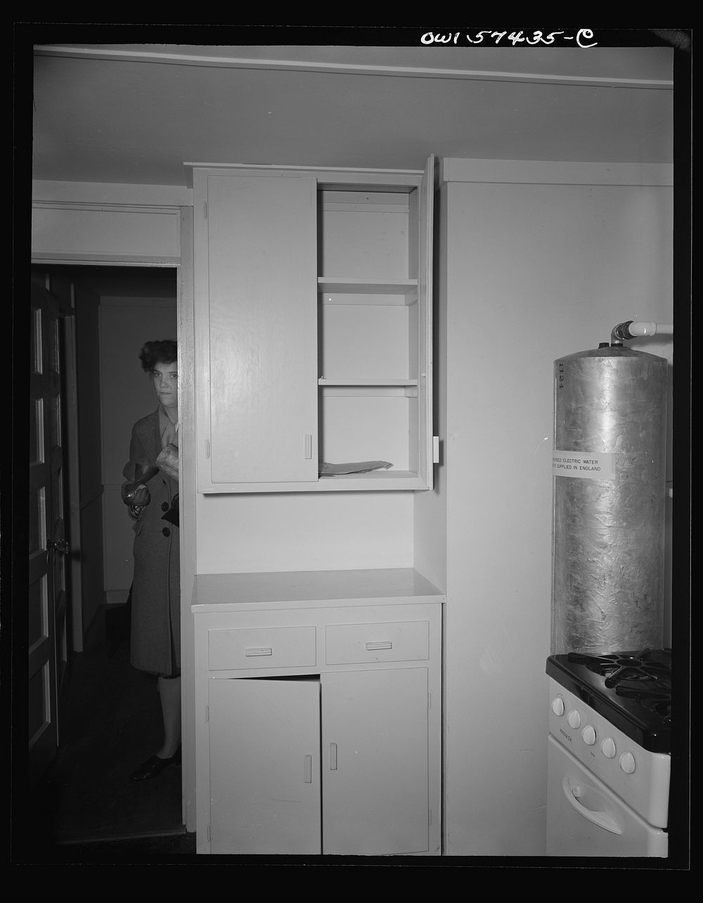 Houses for Britain. Detail of cupboards in corner of kitchen in prefabricated, temporary, emergency house of the type which…