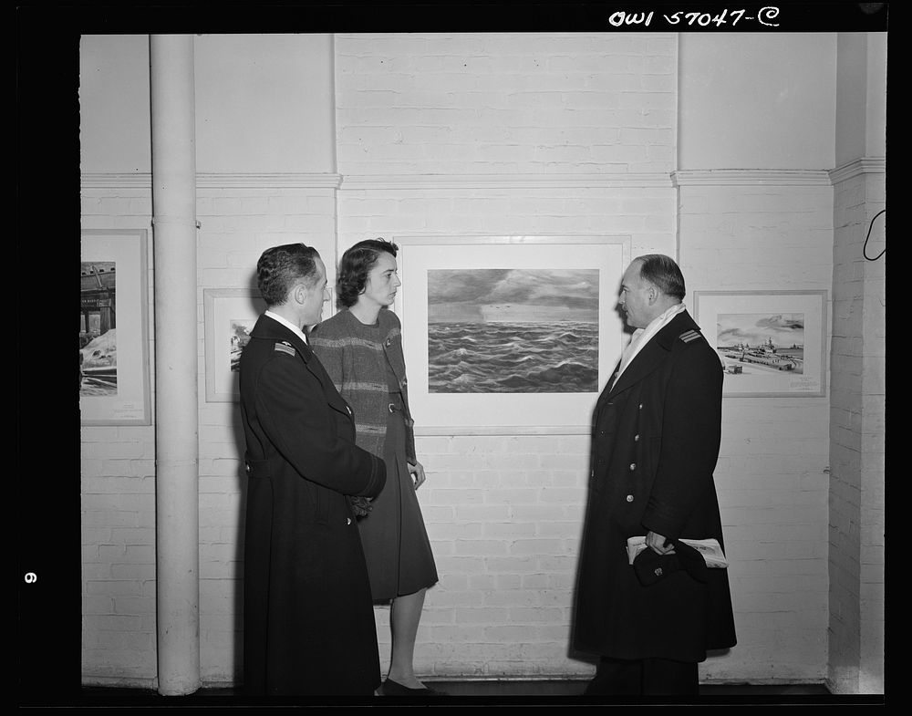 Installation of the United States Office of War Information (OWI) exhibit of original drawings and paintings by artists now…