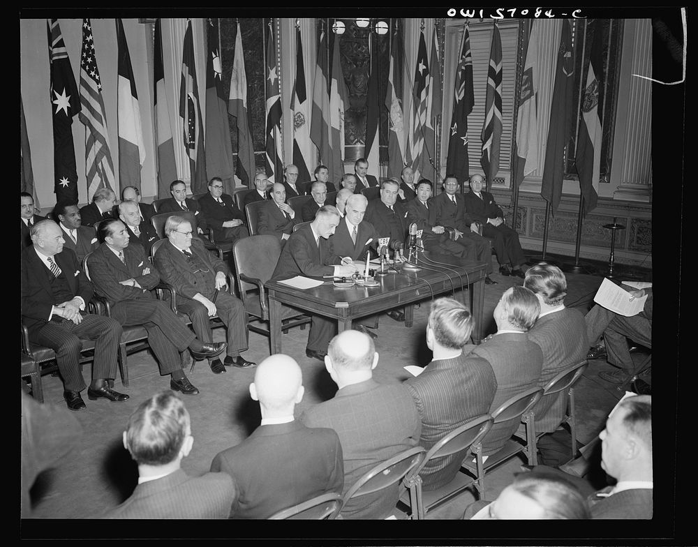 Washington, D.C. Henri Bonnet, French Ambassador, signing the United Nations declaration at the State Department. Sourced…