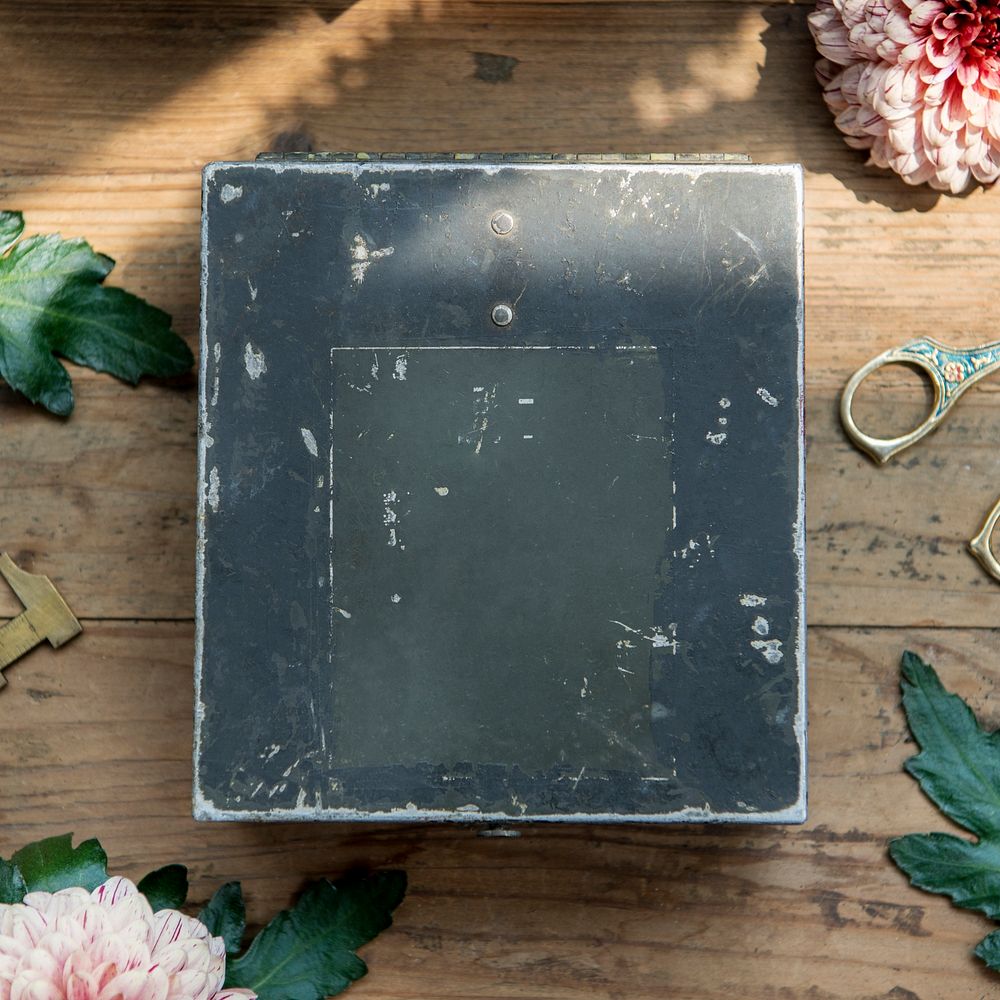 Grunge metal blue box mockup on a wooden table