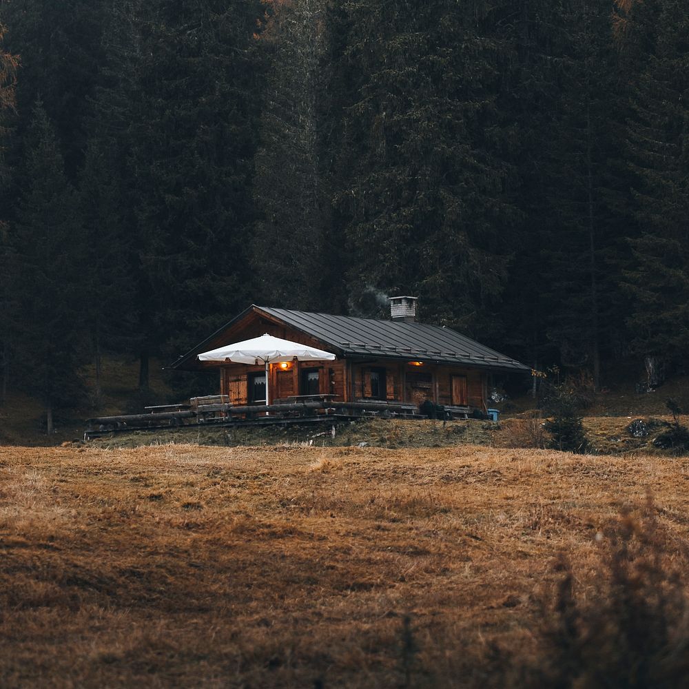 Cozy cottage among autumn nature