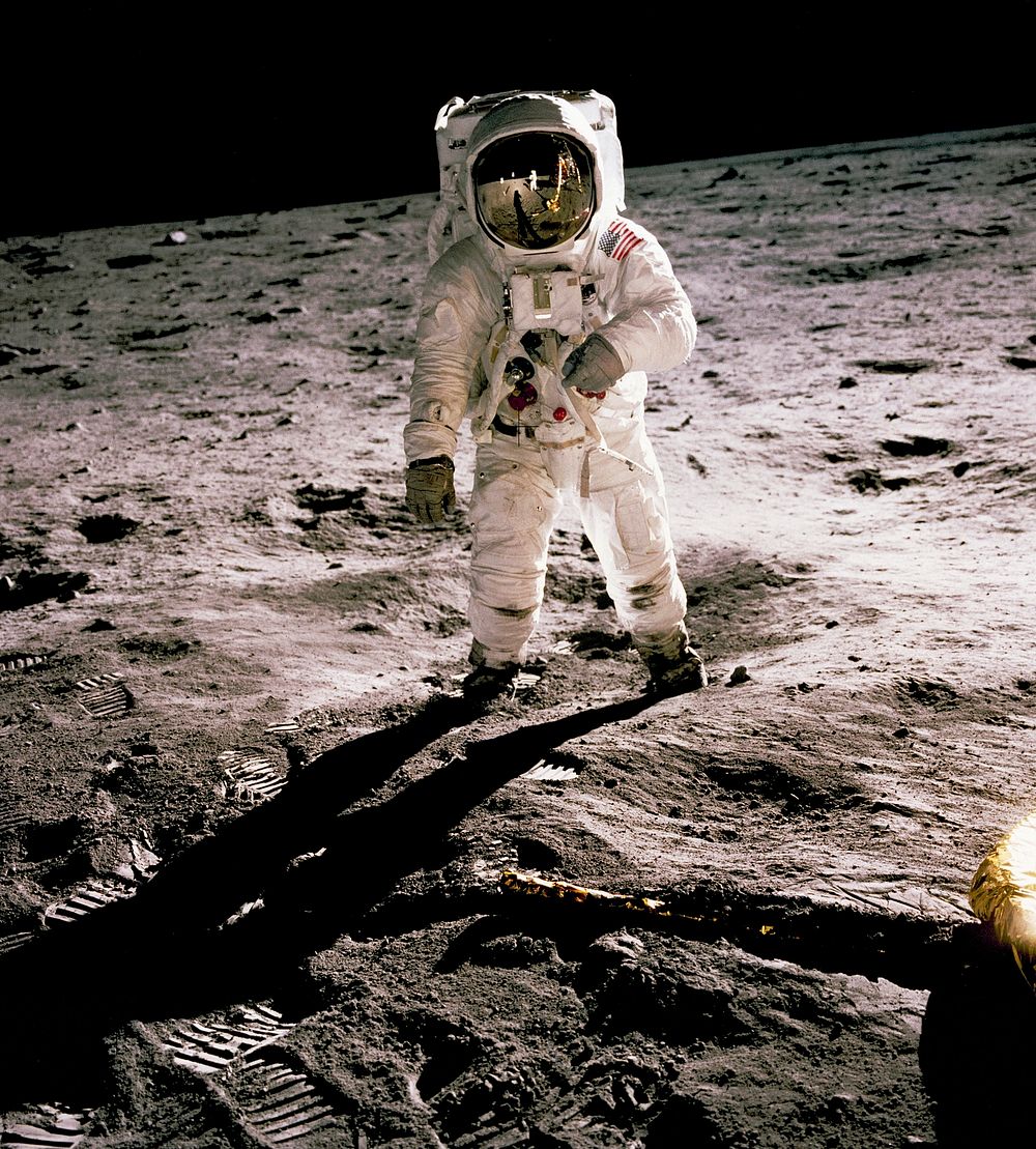 Edwin Aldrin walking on the lunar surface. Neil Armstrong, who took the photograph, can be seen reflected in Aldrin&rsquo;s…