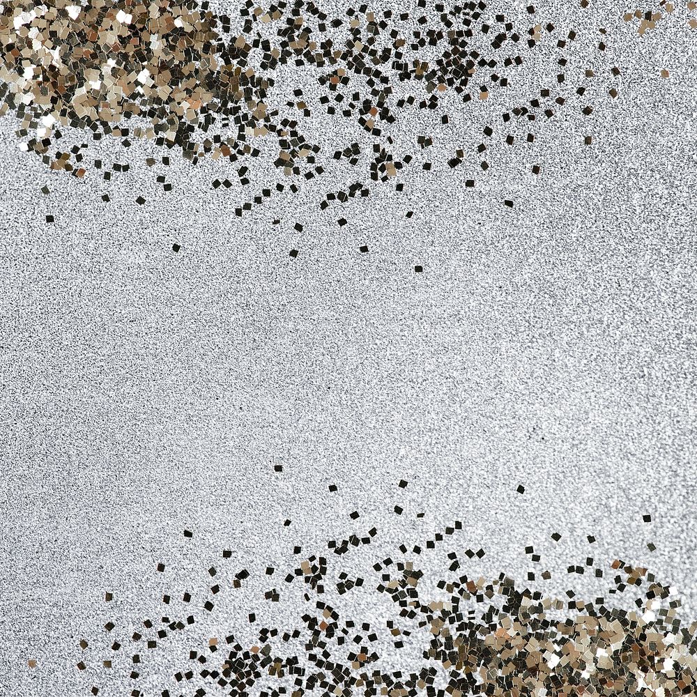 Gold glitter confetti on a silver background 