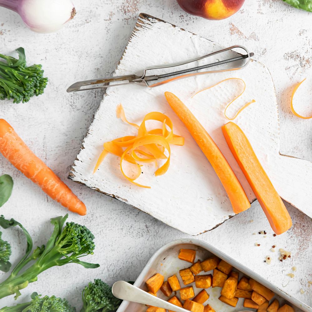 Peeled carrot baked sweet potatoes cooked quinoa preparation