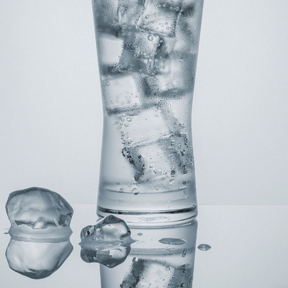 Glass of water with ice macro shot