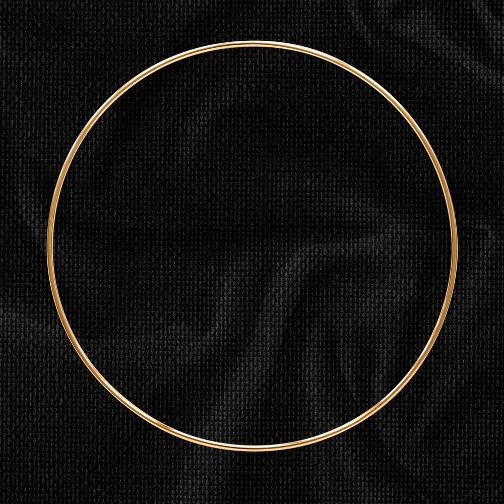 Round gold frame on a black textured background
