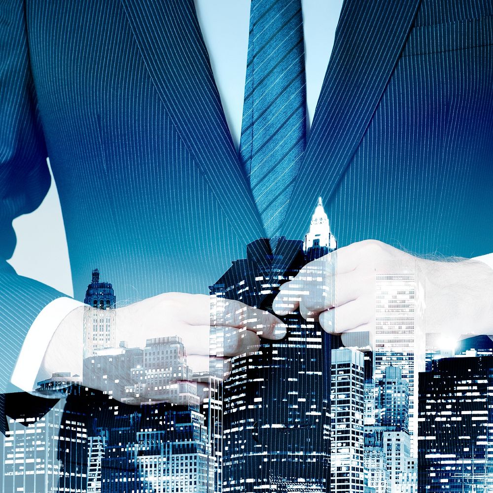 Businessman in suit on city background