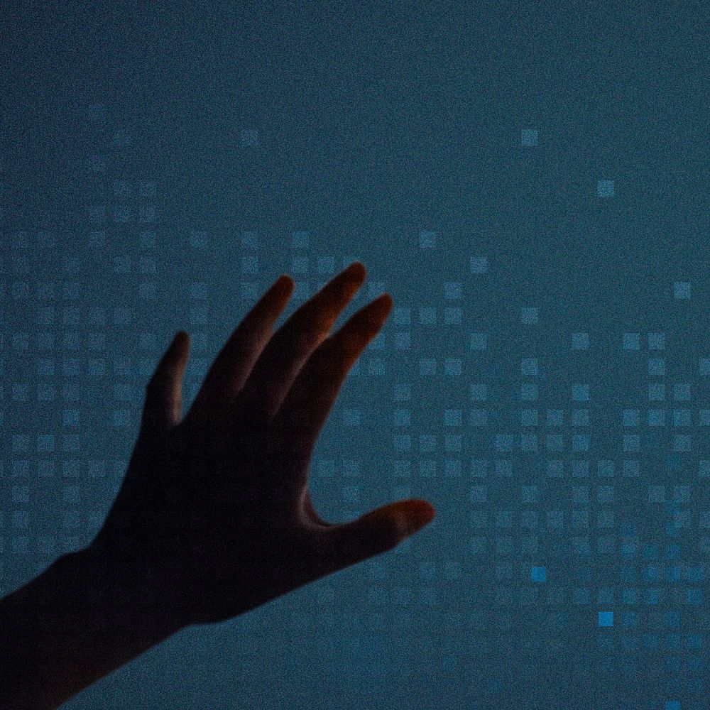 Hand touching blue presentation screen