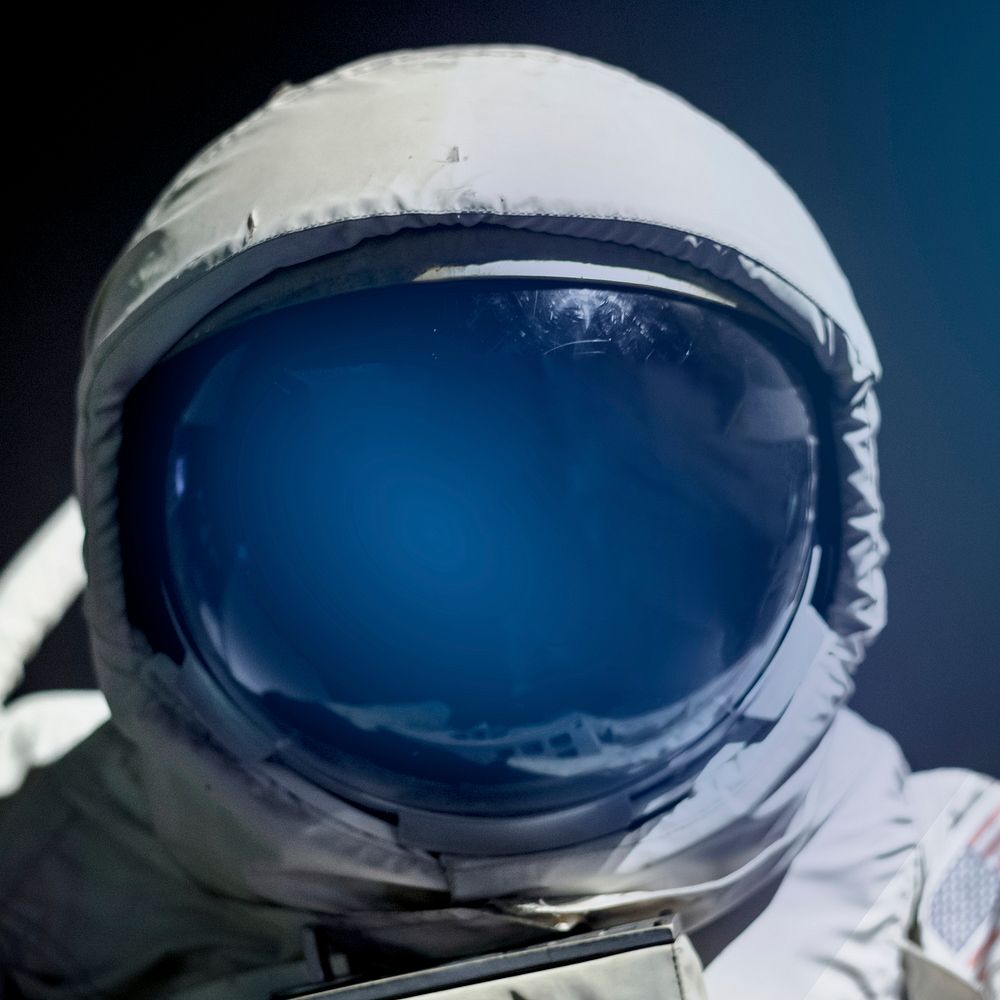 Spacesuit helmet visor close up on astronaut
