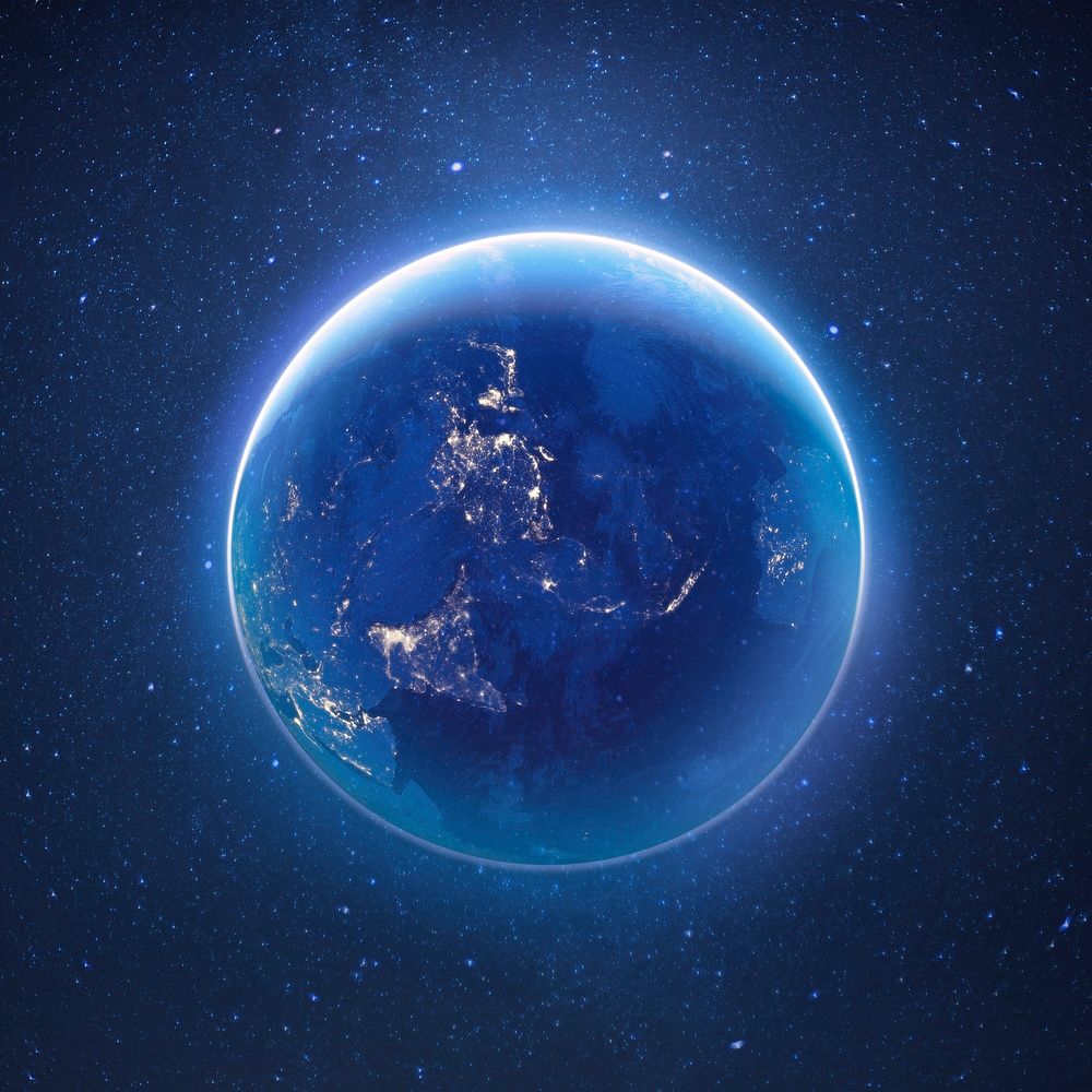 Glowing planet Earth in space, blue background