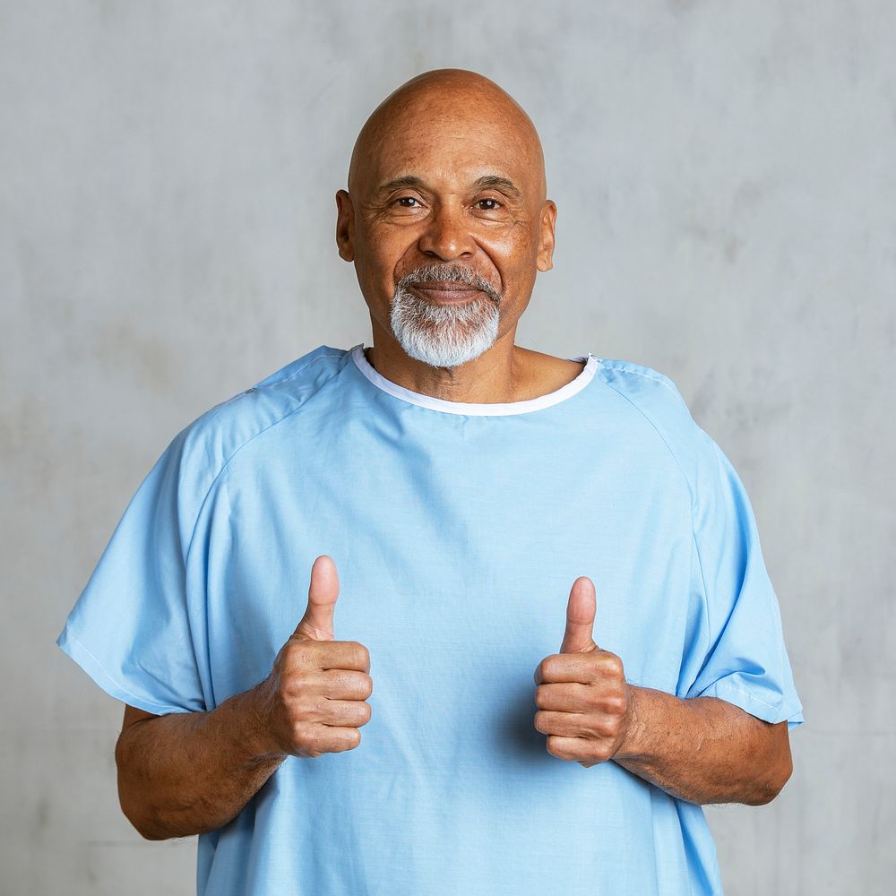 Patient doing a thumbs up hand gesture 