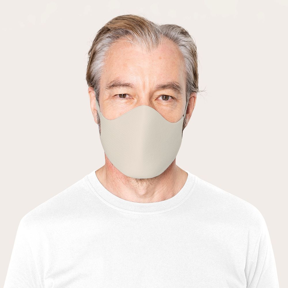 Senior man wearing beige face mask covid-19 campaign with design space